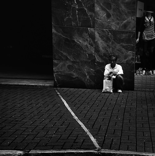 Psalm Of The Streets #8 by Jeremy Chin - Man Sitting By Building, Hong Kong