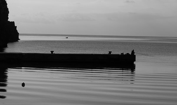 Quiet Times #13 by Jeremy Chin - Fishing by the Popeye Village, Malta
