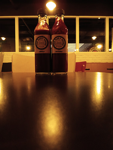 Stills #4 by Jeremy Chin - Sauce Bottle at the Daily Grind, Bangsar